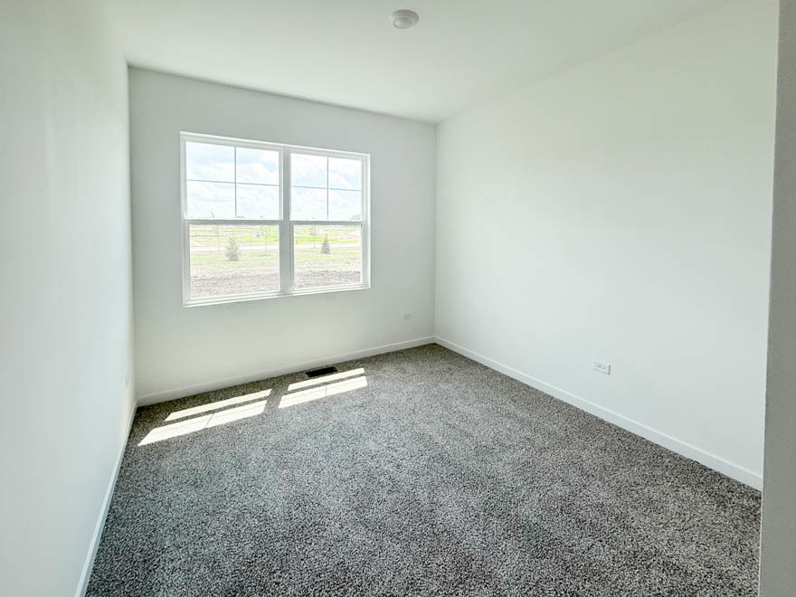2459 Scribe Street Oswego, IL 60543 - Photo 11 of 26 an empty room with a window
