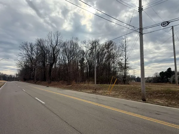 a sign that is on a brick wall