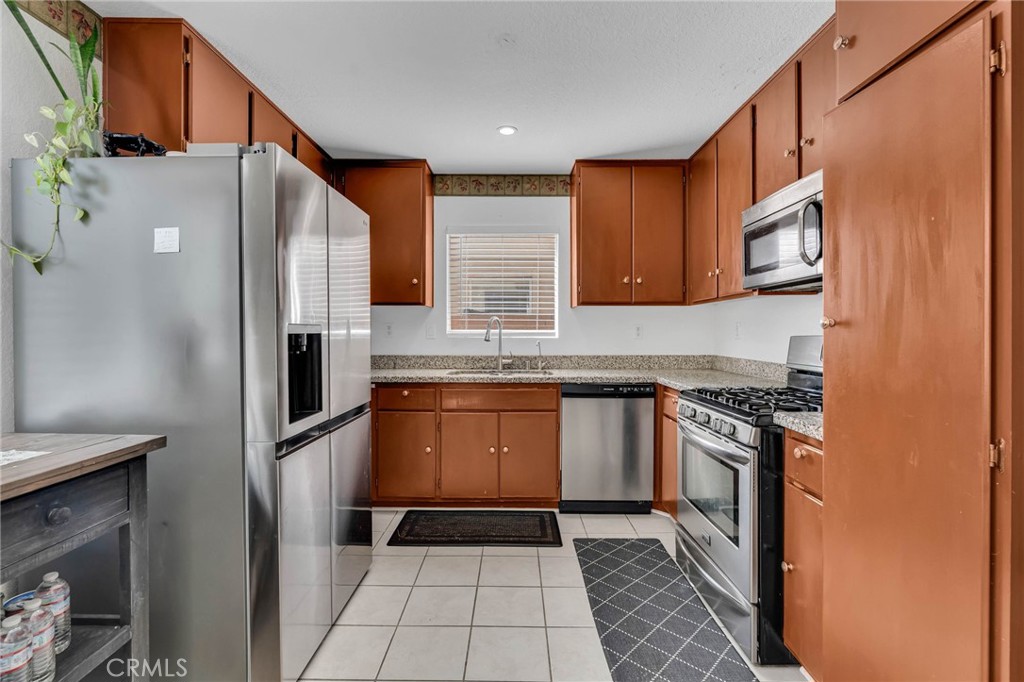 9155 Cedros Avenue, Unit 12 Panorama City, CA 91402 - Photo 13 of 34 Kitchen with Granite counter tops and Tile floors