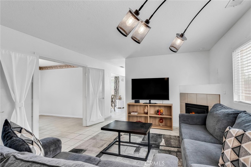 9155 Cedros Avenue, Unit 12 Panorama City, CA 91402 - Photo 8 of 34 Living Room, Family Room on the left with the double doors