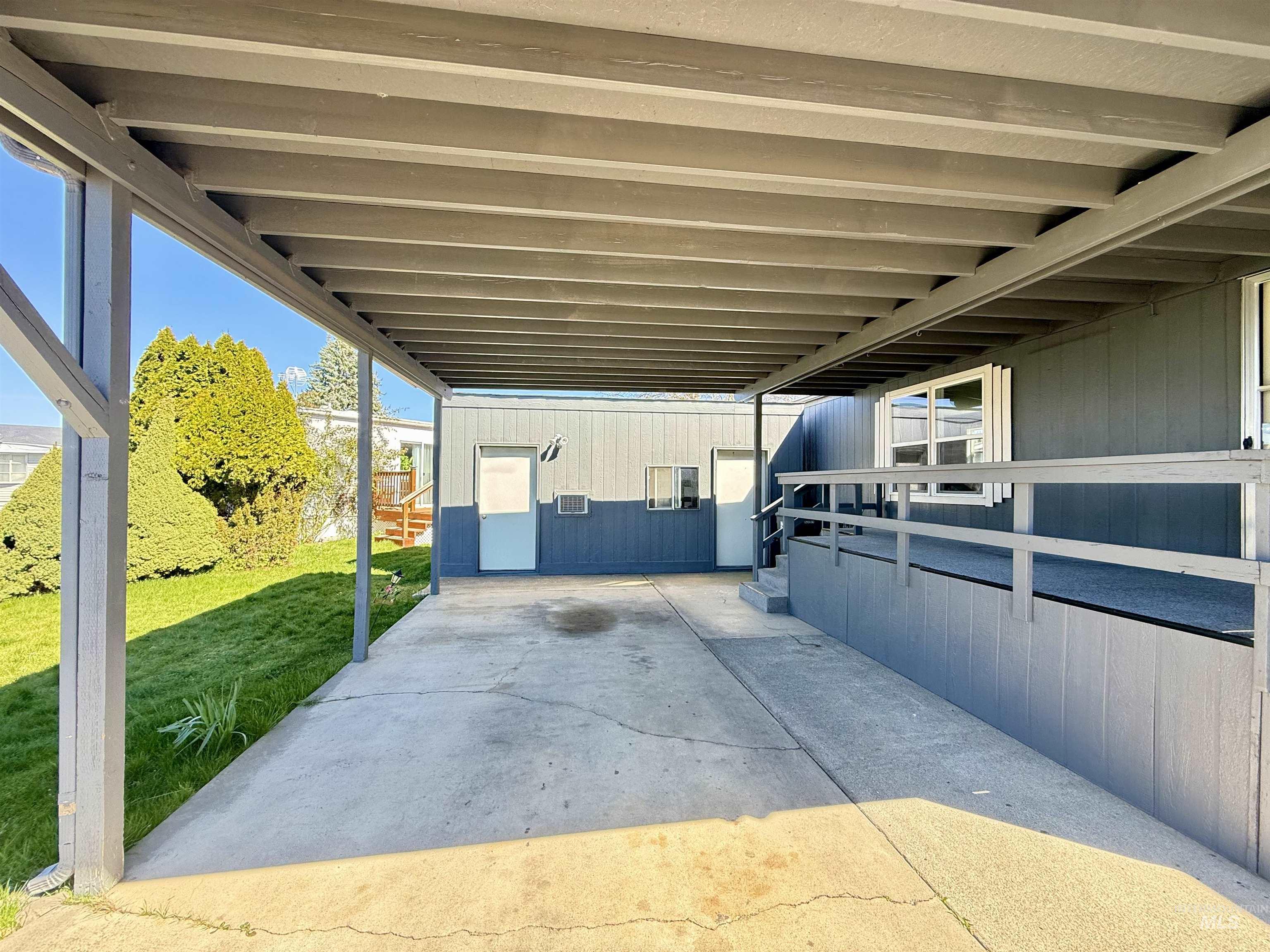 2015 6th Avenue, Unit 321 Clarkston, WA 99403 - Photo 32 of 34 View of patio featuring a carport and an outbuilding