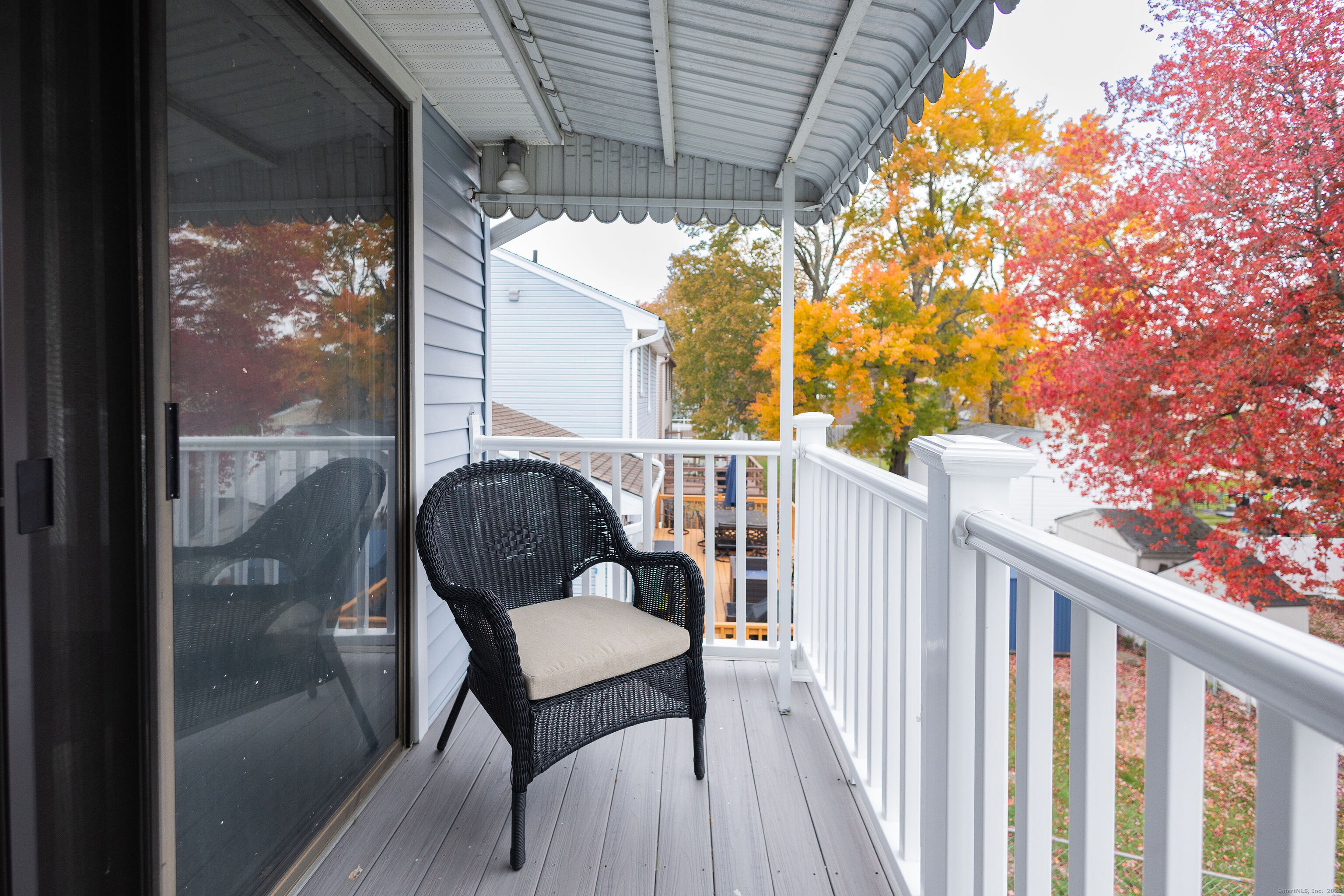 138 Infield Street Bridgeport, CT 06606 - Photo 15 of 31 a porch with a bench next to a yard