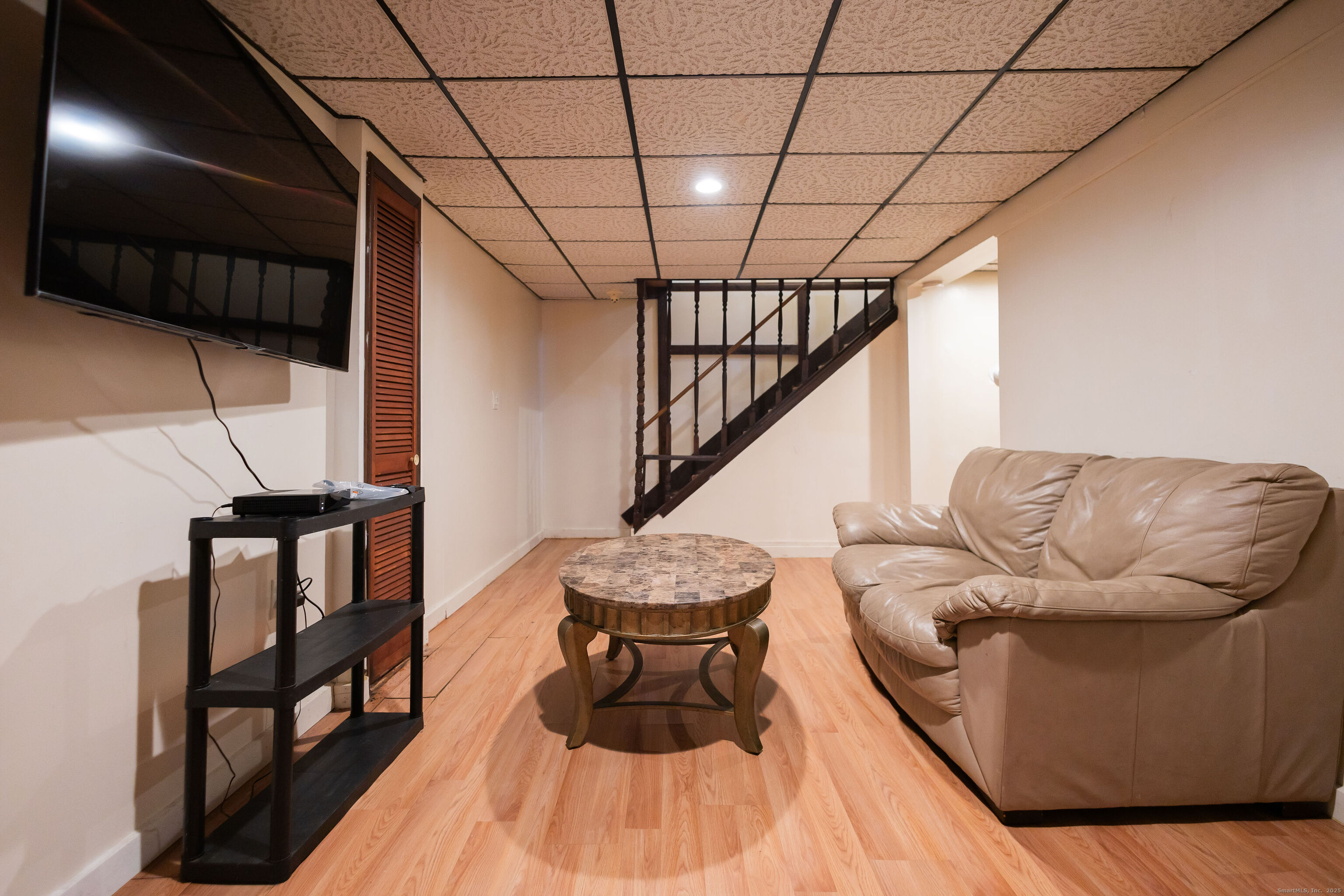 138 Infield Street Bridgeport, CT 06606 - Photo 25 of 31 a view of entryway and hall with wooden floor