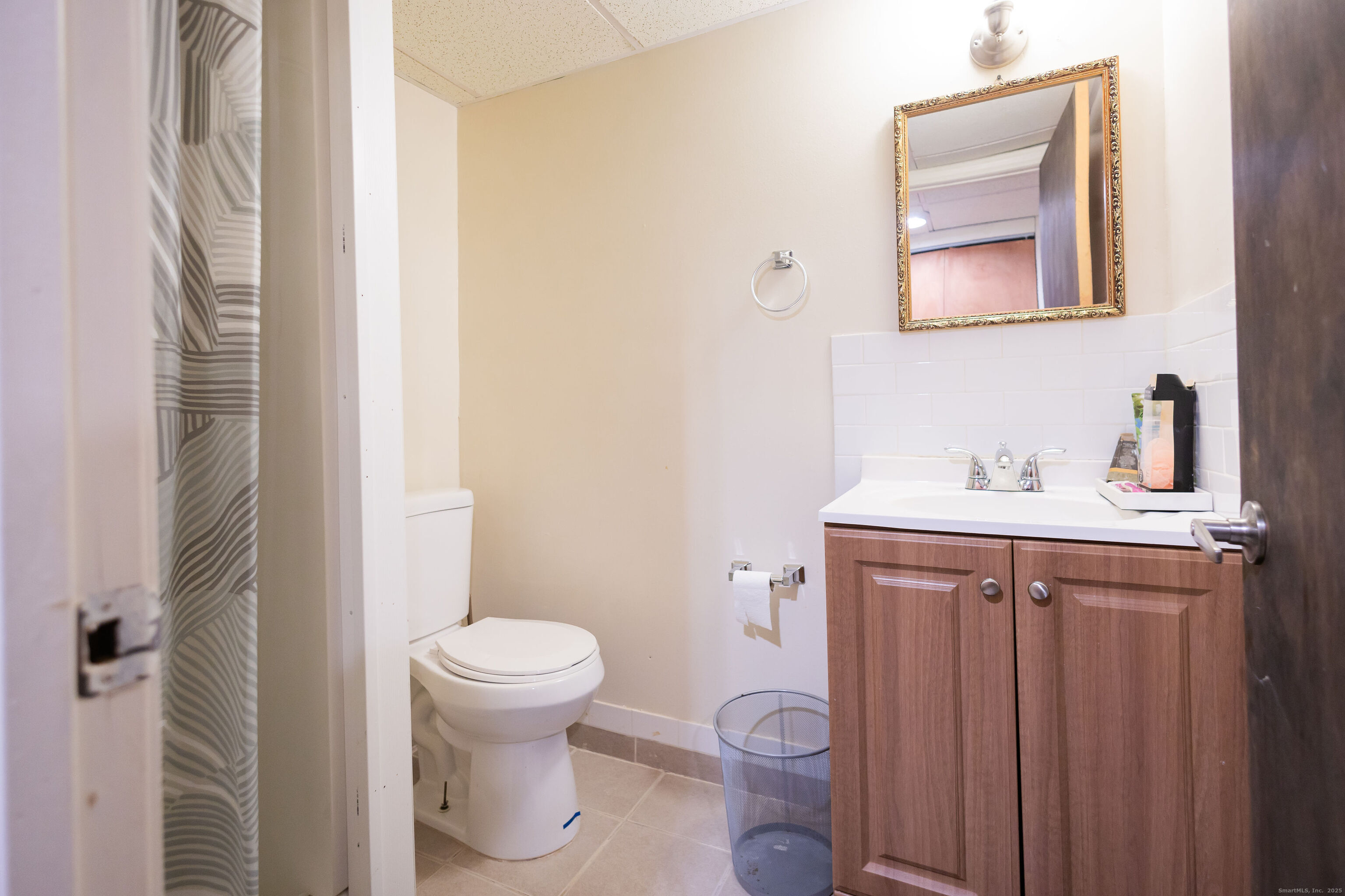 138 Infield Street Bridgeport, CT 06606 - Photo 28 of 31 a bathroom with a sink toilet and a mirror