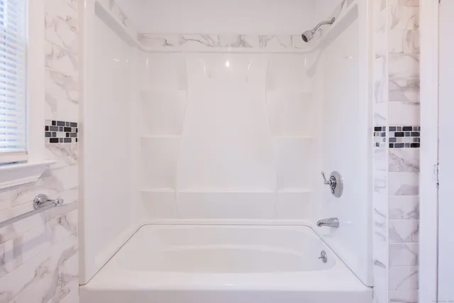 a close view of a bathtub in a bathroom