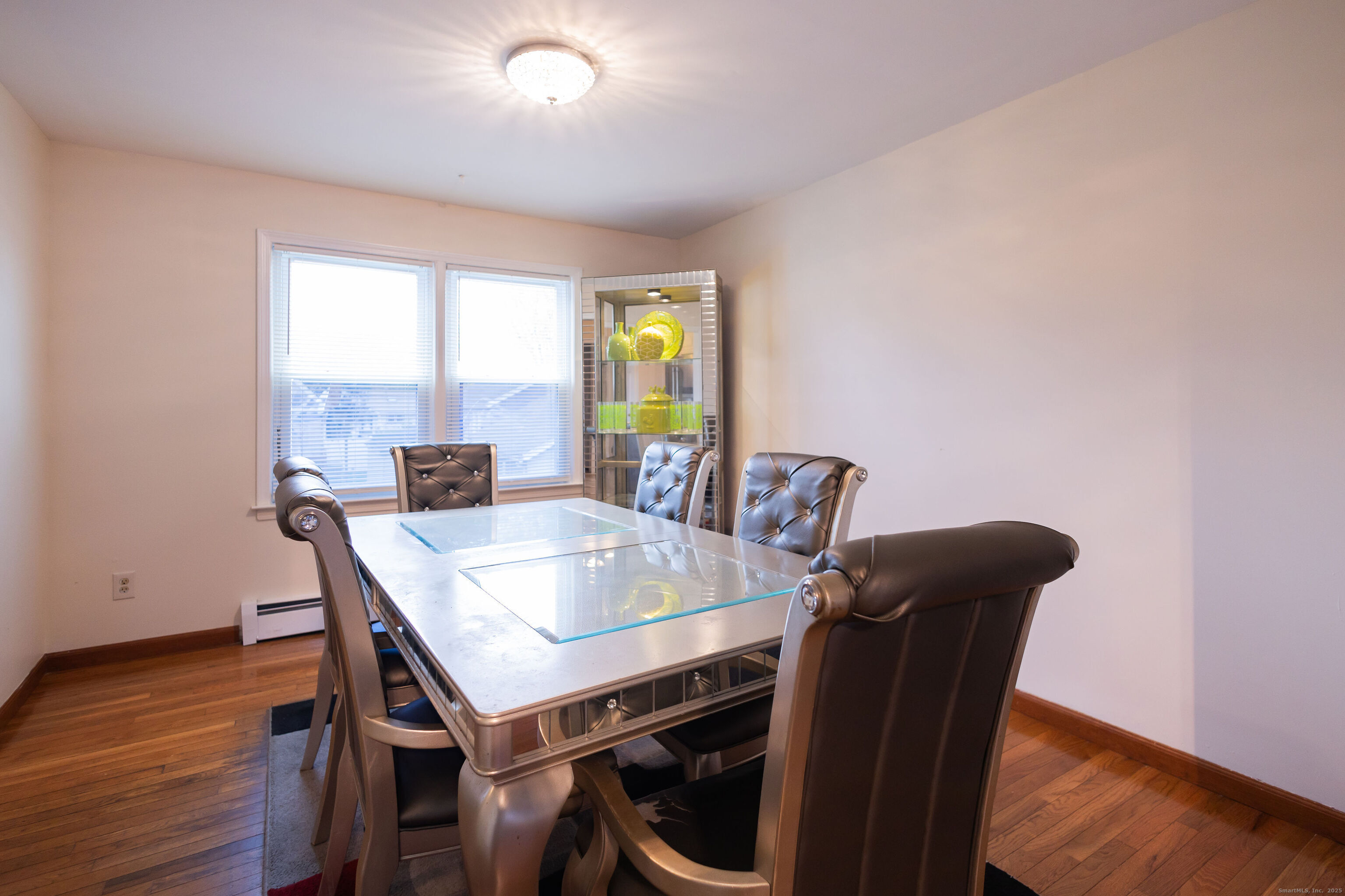 138 Infield Street Bridgeport, CT 06606 - Photo 7 of 31 a view of a dining room with furniture window and wooden floor