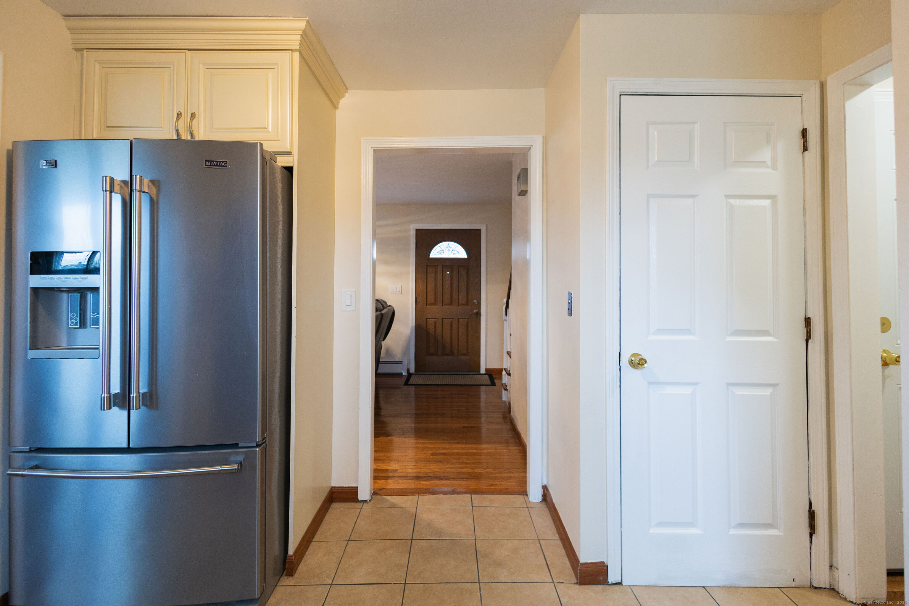138 Infield Street Bridgeport, CT 06606 - Photo 10 of 31 a view of a refrigerator in kitchen and a window in a kitchen