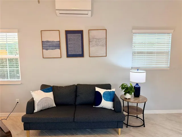 a living room with furniture and a window