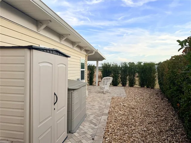 a view of a house with a snow in the background