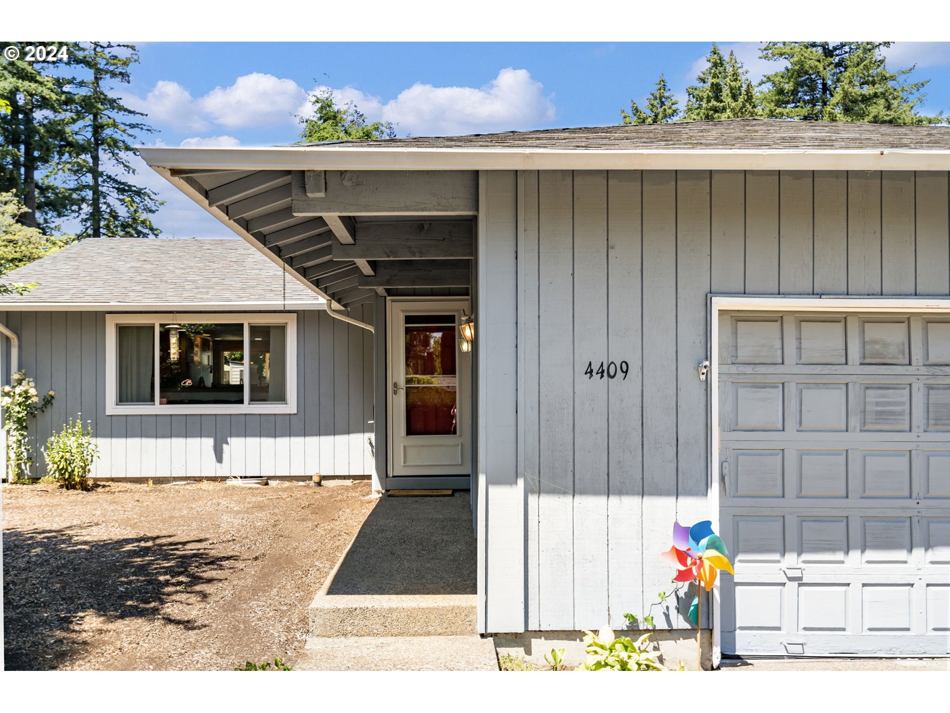 4409 Southwest Kanan Drive Portland, OR 97221 - Photo 2 of 25 a view of a house with a patio