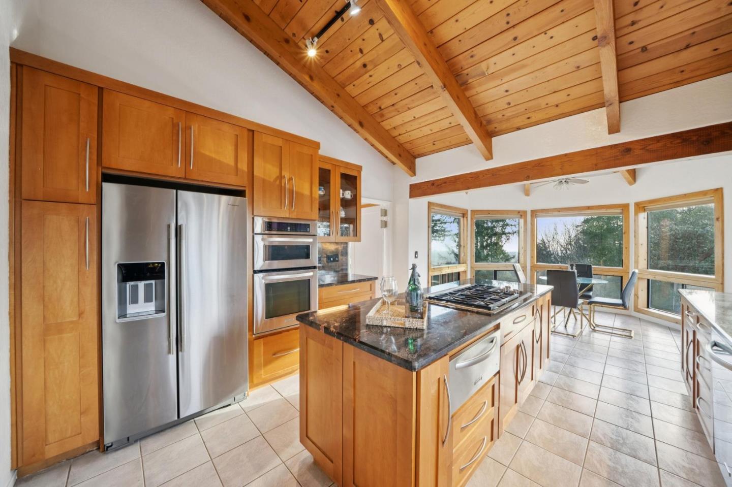 600 Ridge Top Road Los Gatos, CA 95033 - Photo 26 of 81 a kitchen with stainless steel appliances granite countertop a sink and a refrigerator