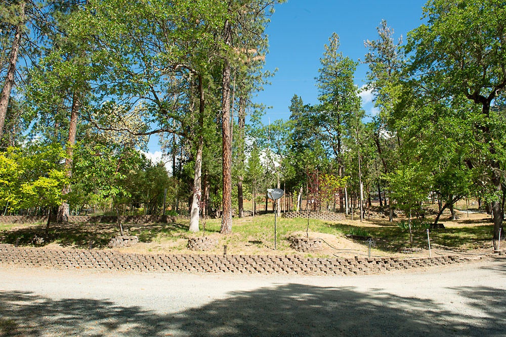 3033 Granite Hill Road Grants Pass, OR 97526 - Photo 29 of 31 Large landscaped garden area with sprinklers and drip lines.