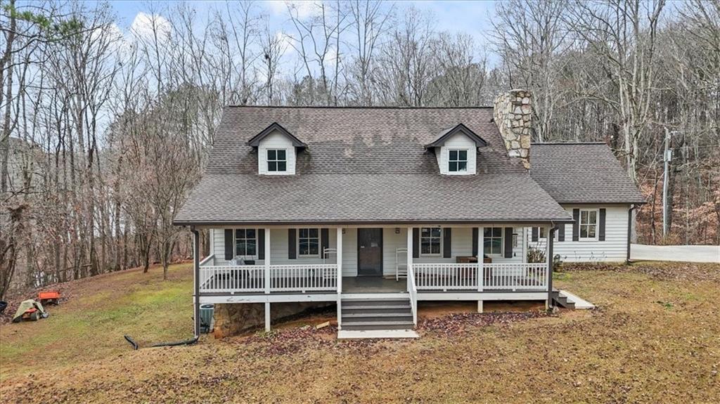 1075 Johnson Brady Road Canton, GA 30115 - Photo 13 of 30 a front view of a house with a wooden fence
