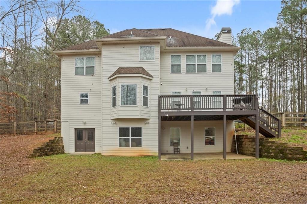 1075 Johnson Brady Road Canton, GA 30115 - Photo 17 of 30 a front view of a house with yard