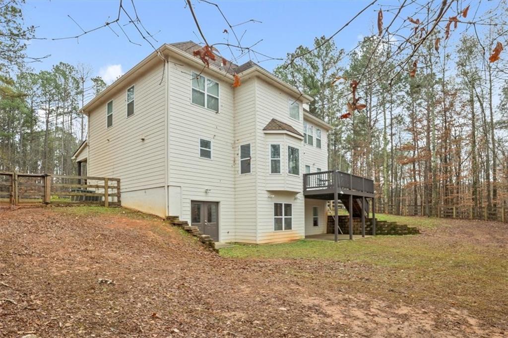 1075 Johnson Brady Road Canton, GA 30115 - Photo 18 of 30 a view of a house with a yard