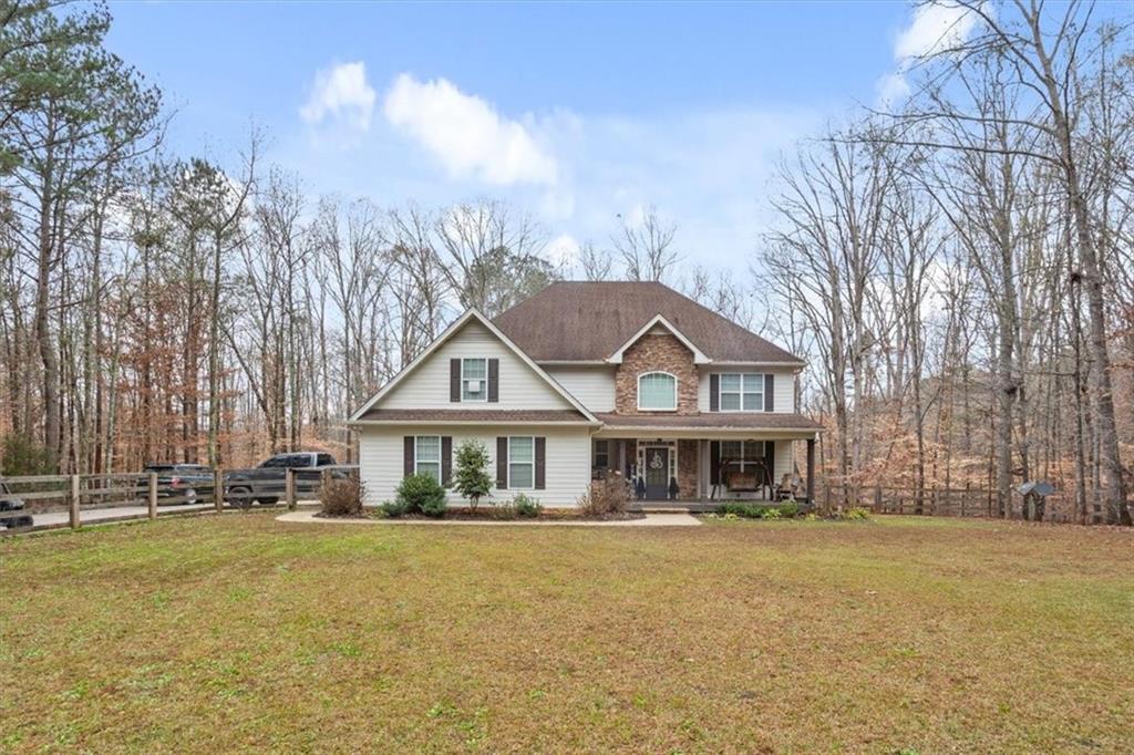 1075 Johnson Brady Road Canton, GA 30115 - Photo 20 of 30 a front view of a house with a garden