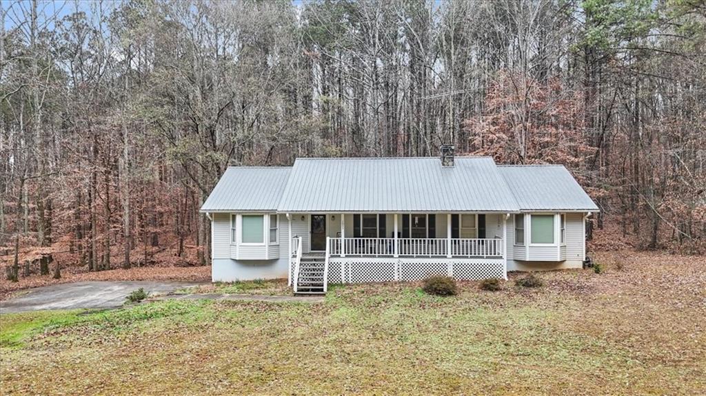 1075 Johnson Brady Road Canton, GA 30115 - Photo 23 of 30 front view of a house with a yard