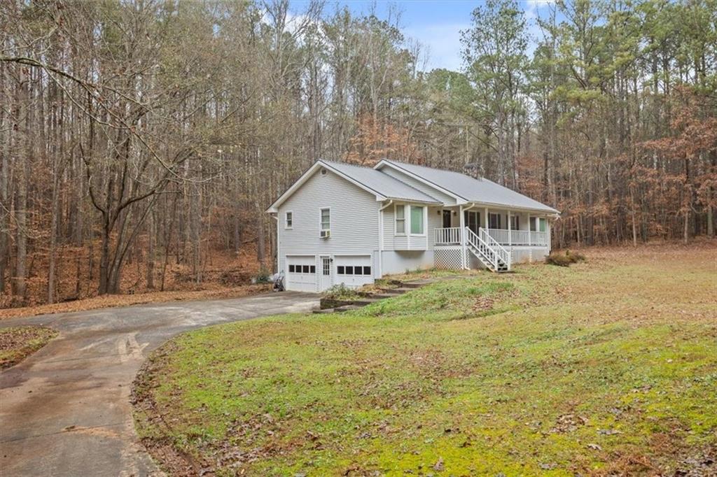 1075 Johnson Brady Road Canton, GA 30115 - Photo 24 of 30 a view of a house with a yard patio and deck