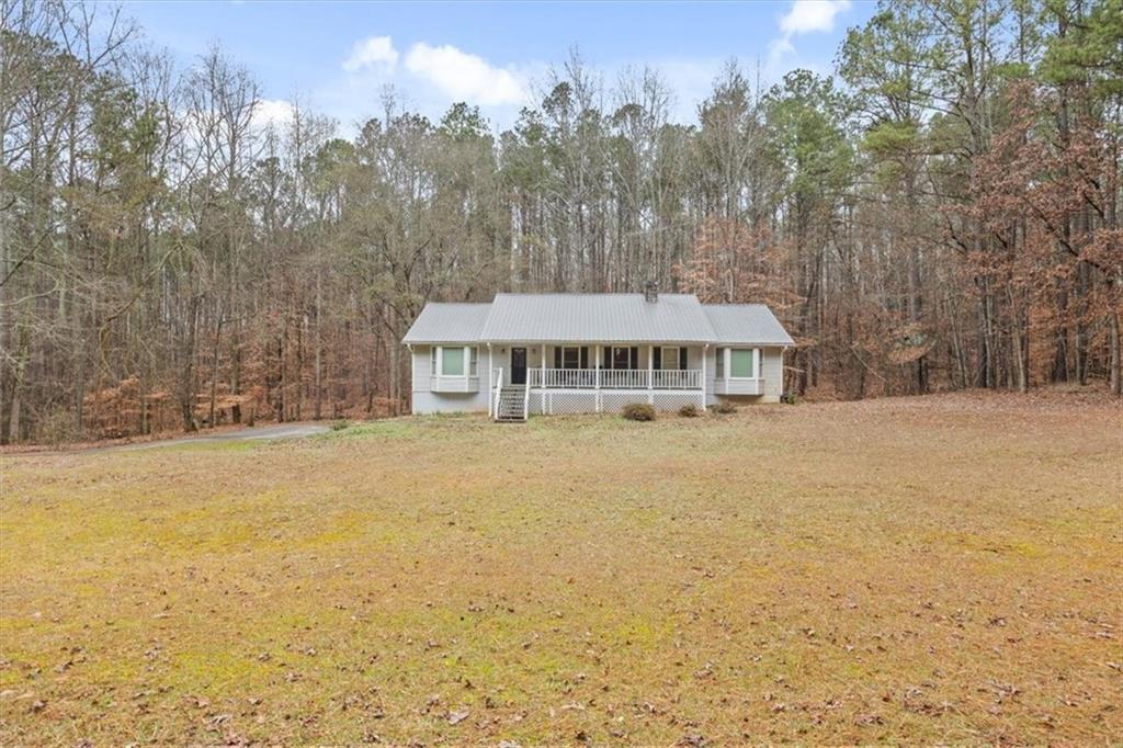 1075 Johnson Brady Road Canton, GA 30115 - Photo 25 of 30 a front view of a house with a garden