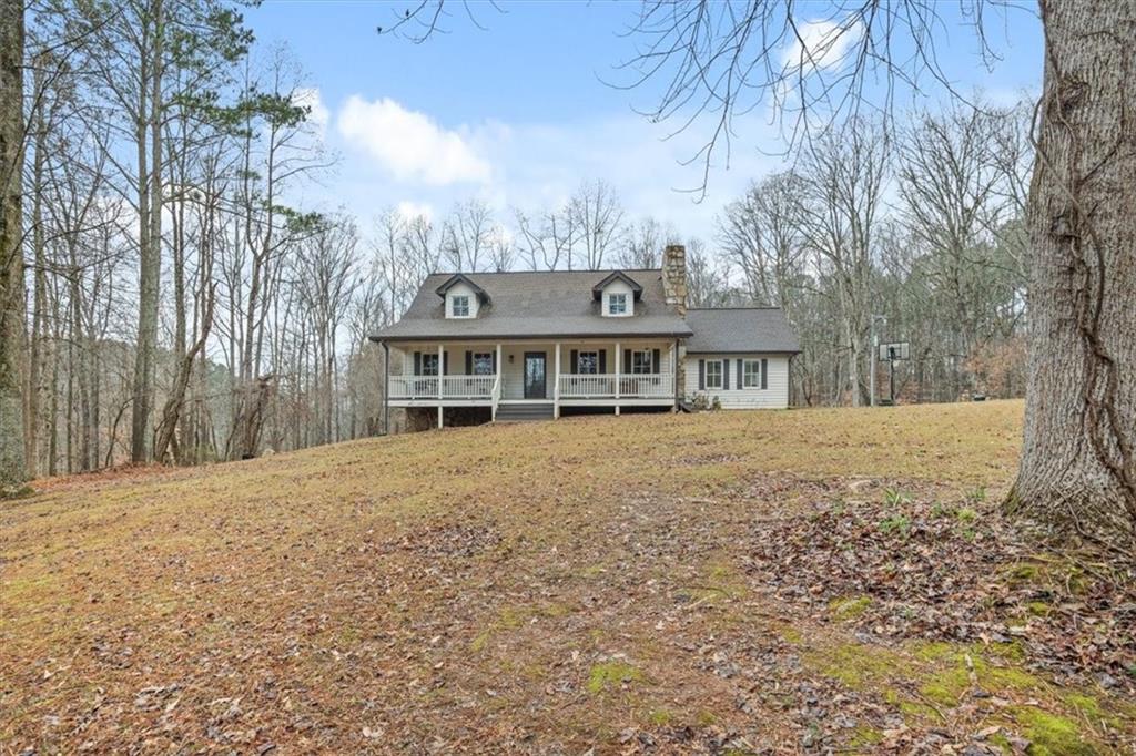 1075 Johnson Brady Road Canton, GA 30115 - Photo 10 of 30 a front view of house with yard and trees around