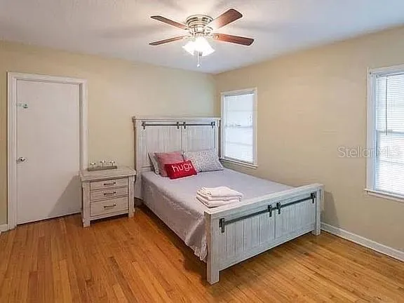 a bedroom with a bed and a dresser