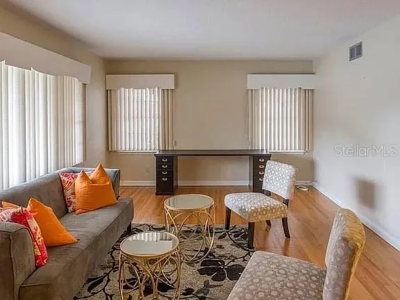 a living room with furniture and a window