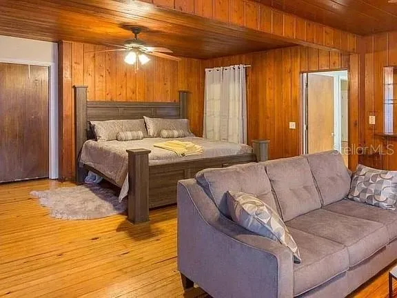 a living room with a bed and furniture