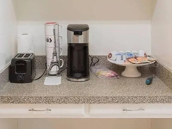 a kitchen with a stove and a refrigerator