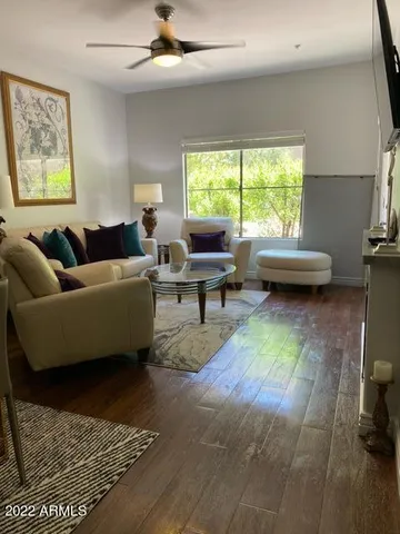 a living room with furniture and a window