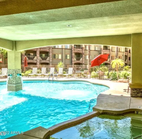 a view of swimming pool with a yard