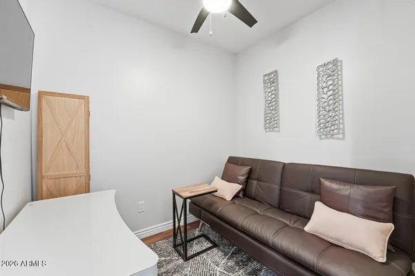 a living room with furniture and a rug