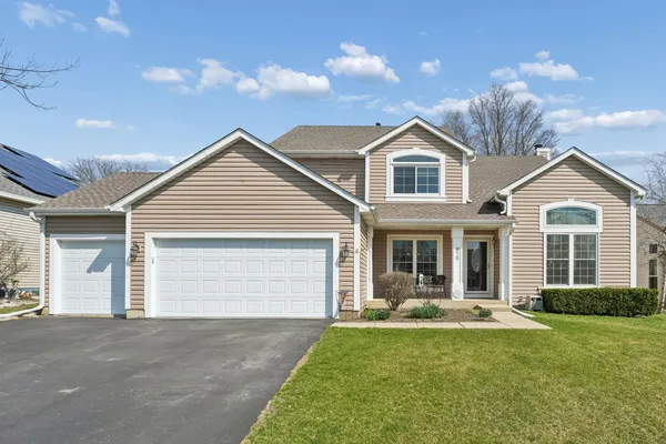 a front view of a house with yard