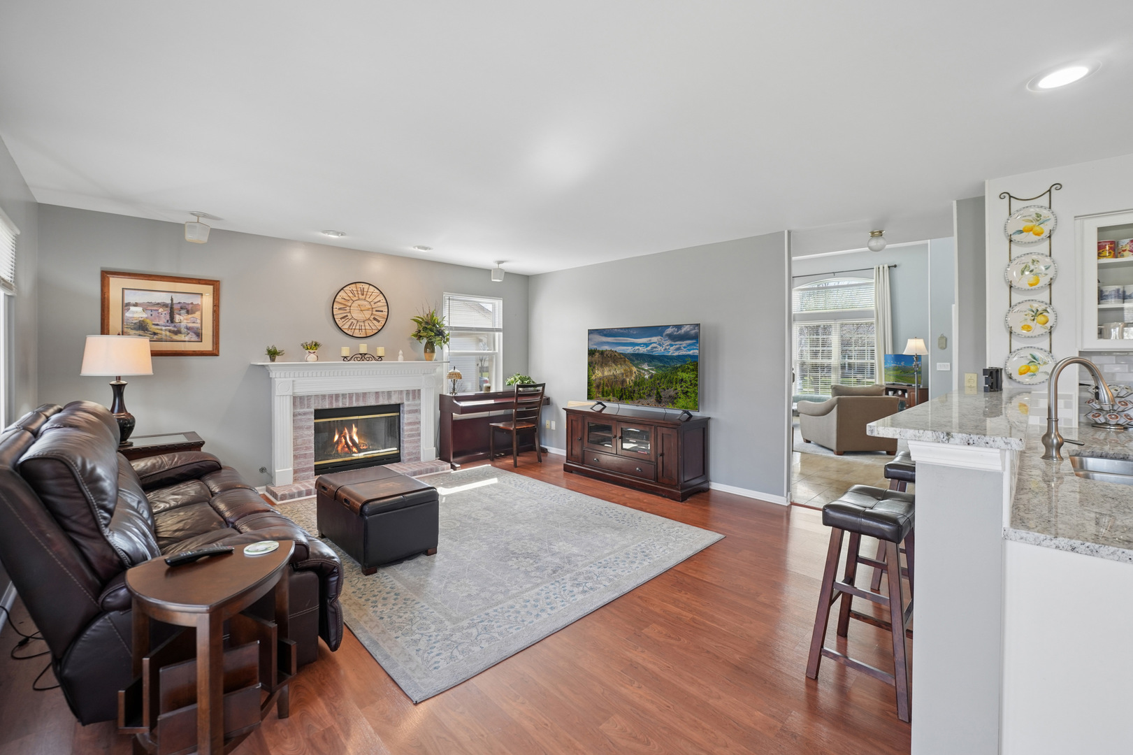 829 Renaissance Drive Carol Stream, IL 60188 - Photo 13 of 35 a living room with furniture a fireplace and a window
