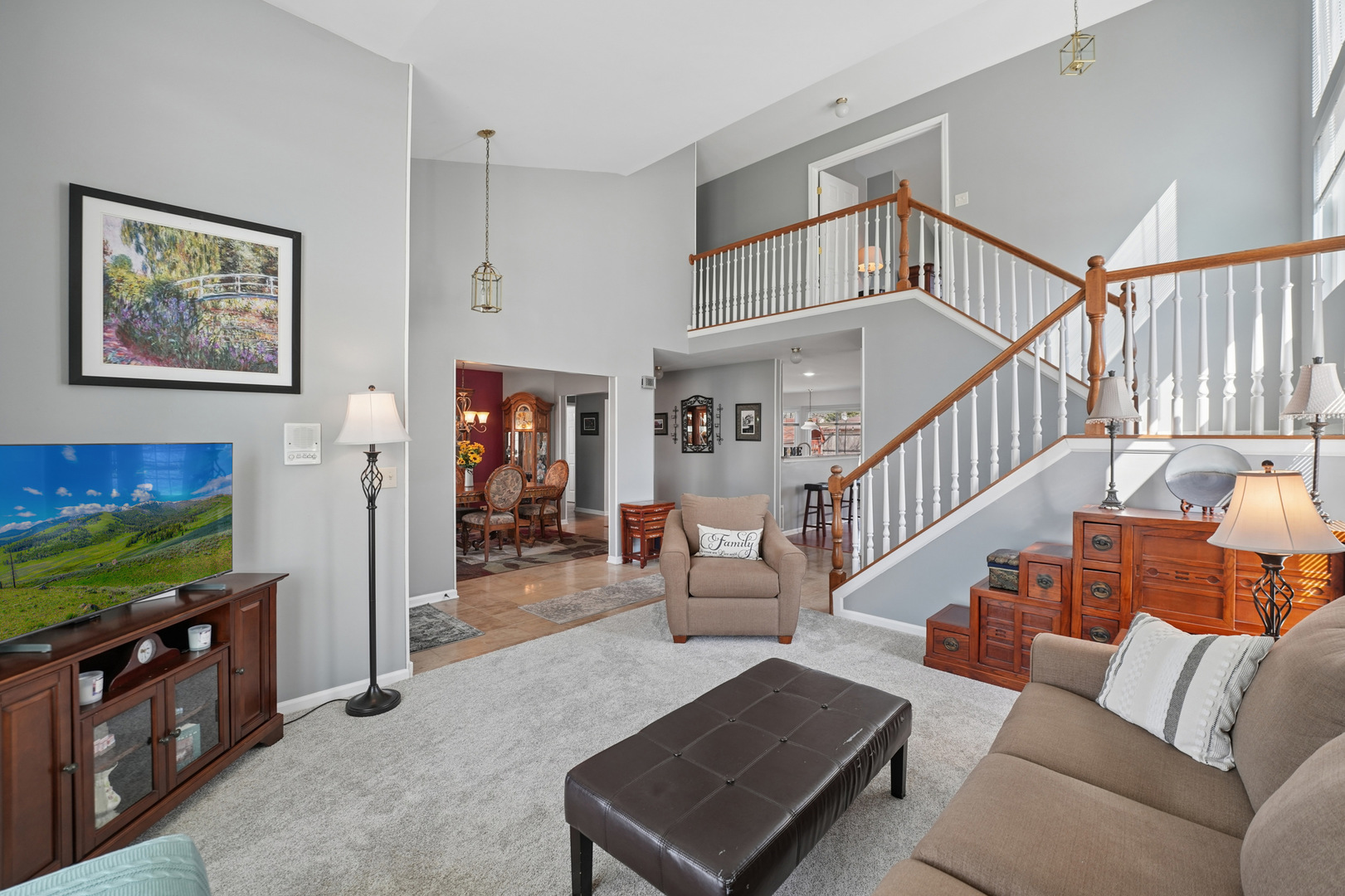 829 Renaissance Drive Carol Stream, IL 60188 - Photo 7 of 35 a living room with furniture and a flat screen tv