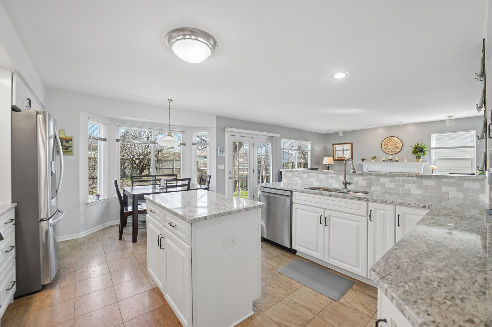829 Renaissance Drive Carol Stream, IL 60188 - Photo 10 of 35 a kitchen with sink refrigerator and cabinets