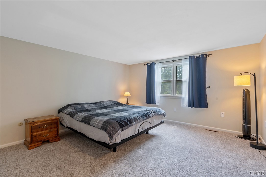 8069 Princess Path Clay, NY 13090 - Photo 26 of 50 The stepdown primary bedroom is large!