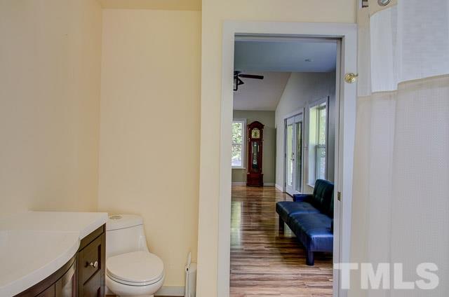 2109 Winkler Road Durham, NC 27712 - Photo 16 of 21 a bathroom with a toilet and a shower