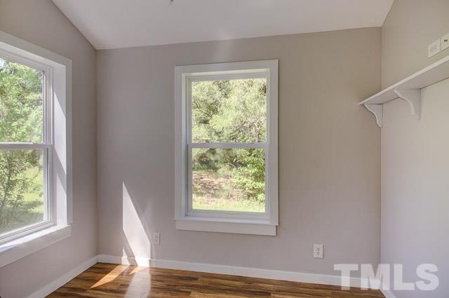 2109 Winkler Road Durham, NC 27712 - Photo 17 of 21 a view of room with window and wooden floor
