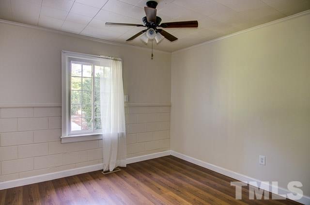2109 Winkler Road Durham, NC 27712 - Photo 19 of 21 a view of empty room with wooden floor and fan