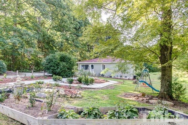 2109 Winkler Road Durham, NC 27712 - Photo 2 of 21 a house view with a sitting space and garden