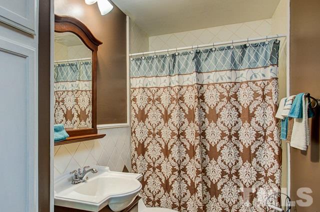 2109 Winkler Road Durham, NC 27712 - Photo 21 of 21 a bathroom with a sink toilet and shower