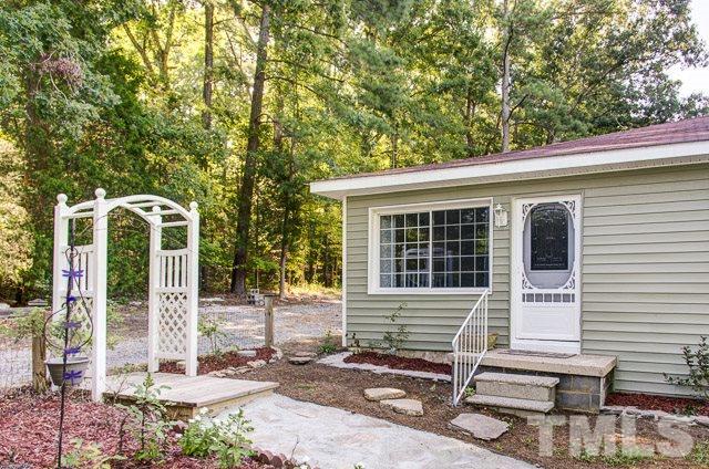 2109 Winkler Road Durham, NC 27712 - Photo 4 of 21 a front view of a house with garden