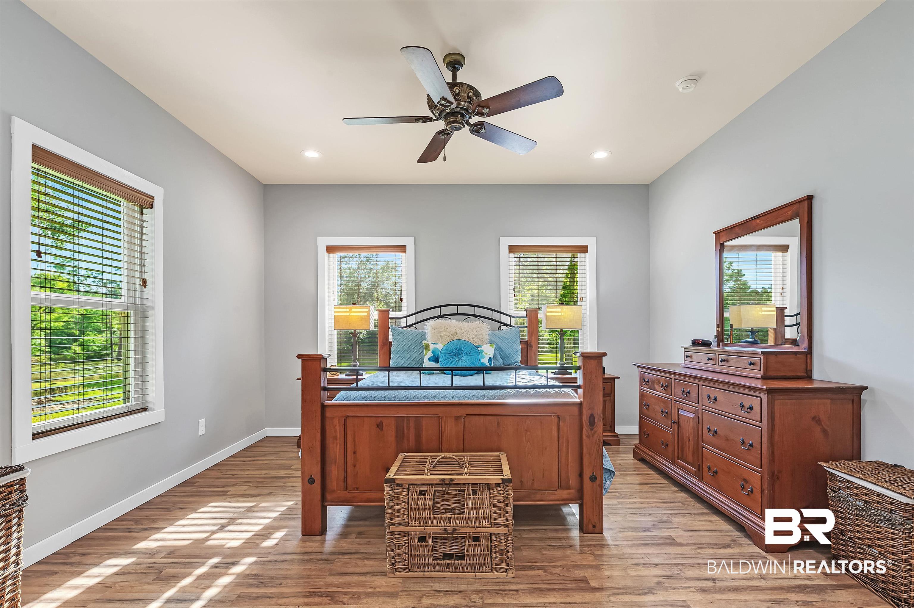 13827 County Road 83 Elberta, AL 36530 - Photo 25 of 38 Bedroom featuring multiple windows, light wood finished floors, baseboards, recessed lighting, and a ceiling fan