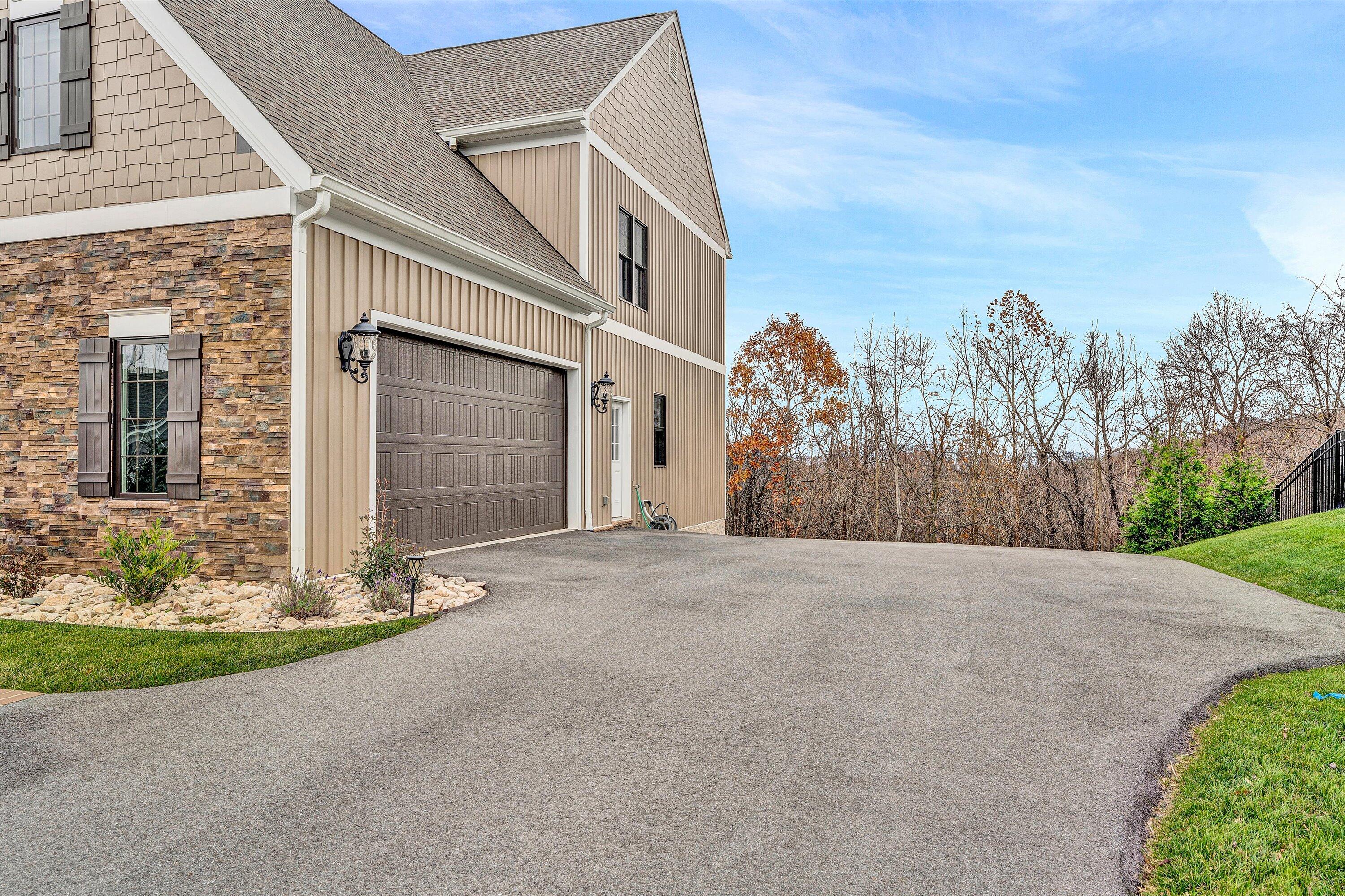 6901 Fairway Ridge Road Salem, VA 24153 - Photo 25 of 58 a front view of a house with a yard and garage