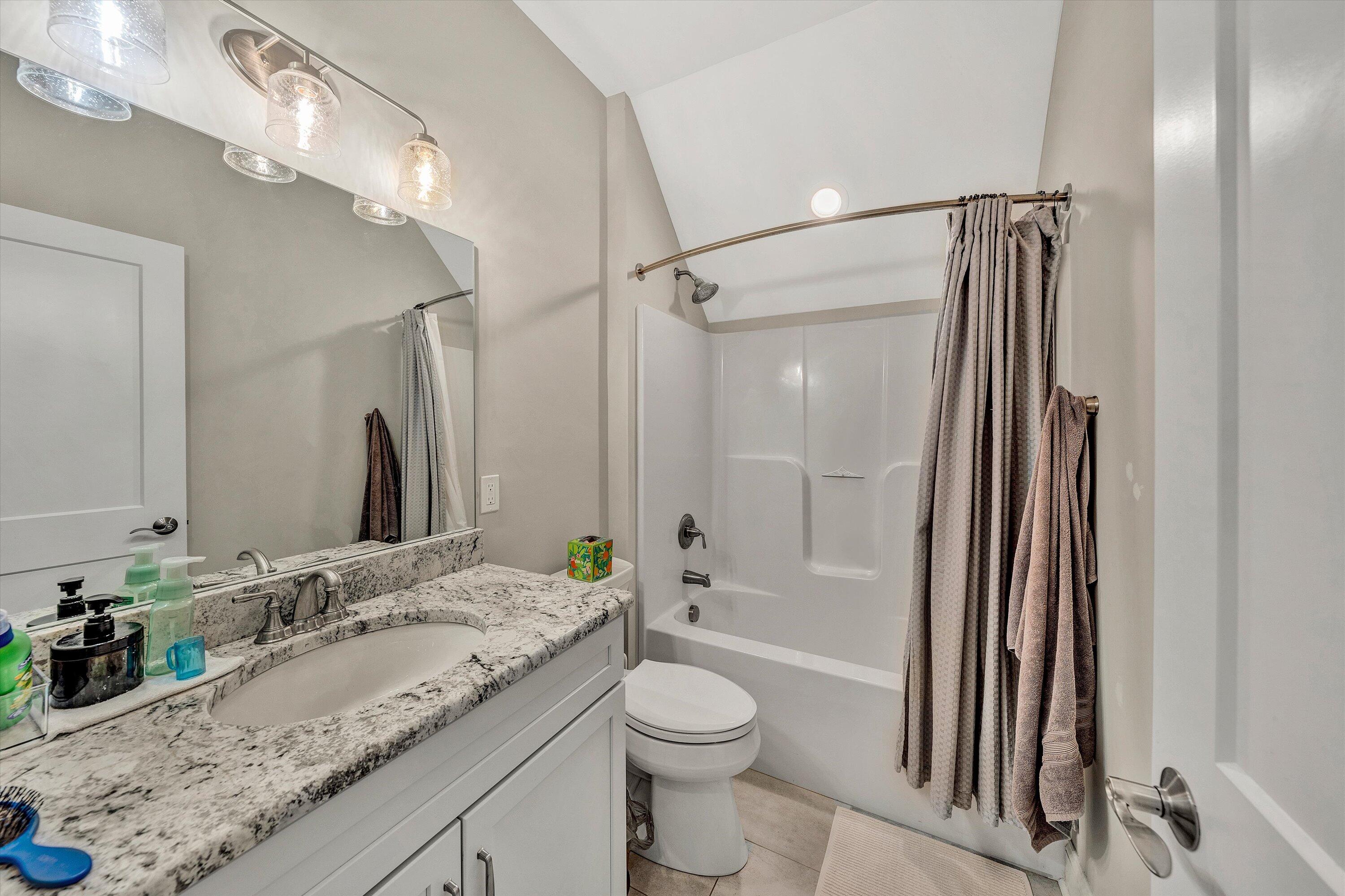 6901 Fairway Ridge Road Salem, VA 24153 - Photo 29 of 58 a bathroom with a granite countertop sink toilet and shower