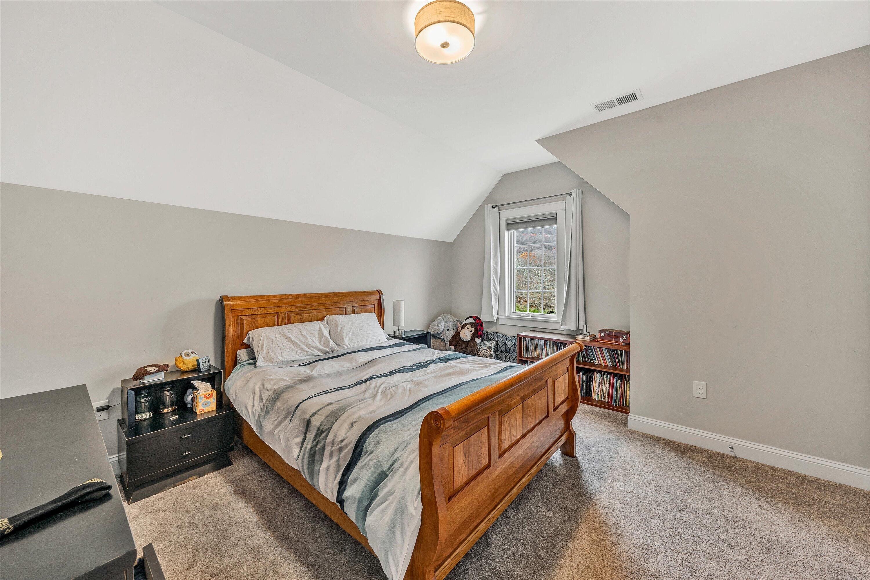 6901 Fairway Ridge Road Salem, VA 24153 - Photo 30 of 58 a bed sitting in a bedroom next to a window