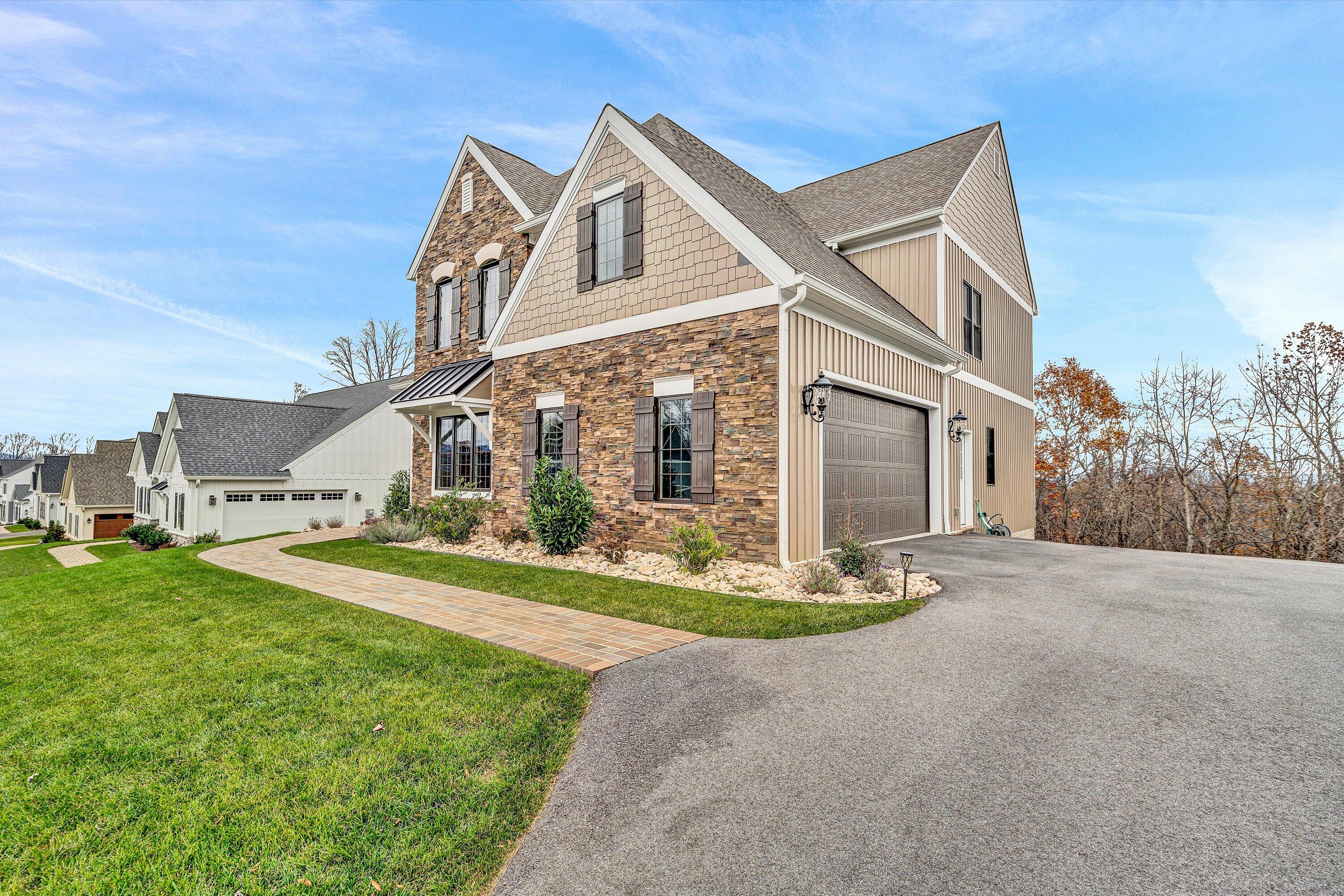 6901 Fairway Ridge Road Salem, VA 24153 - Photo 3 of 58 a front view of a house with a yard and garage