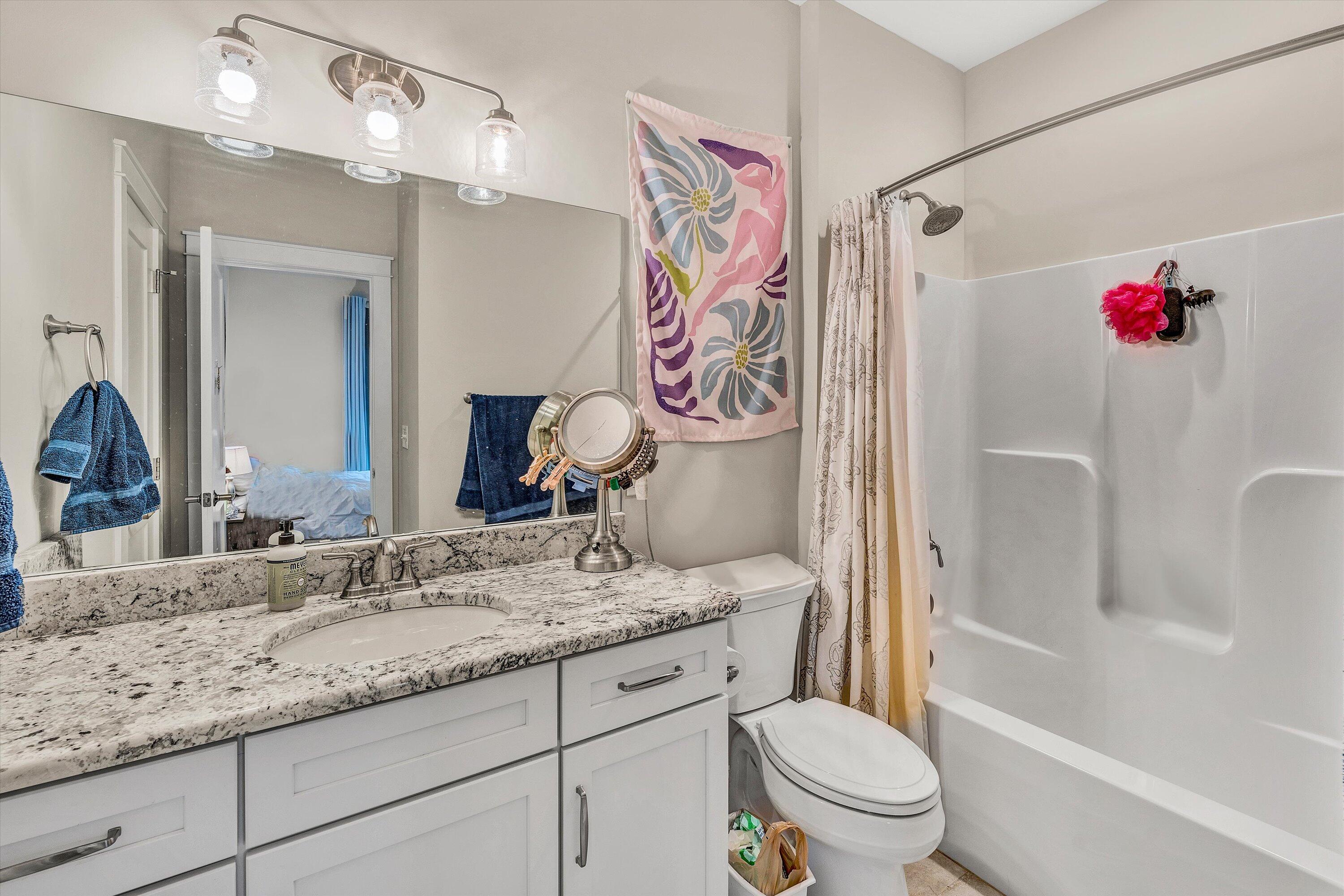 6901 Fairway Ridge Road Salem, VA 24153 - Photo 38 of 58 a bathroom with a granite countertop sink toilet and shower