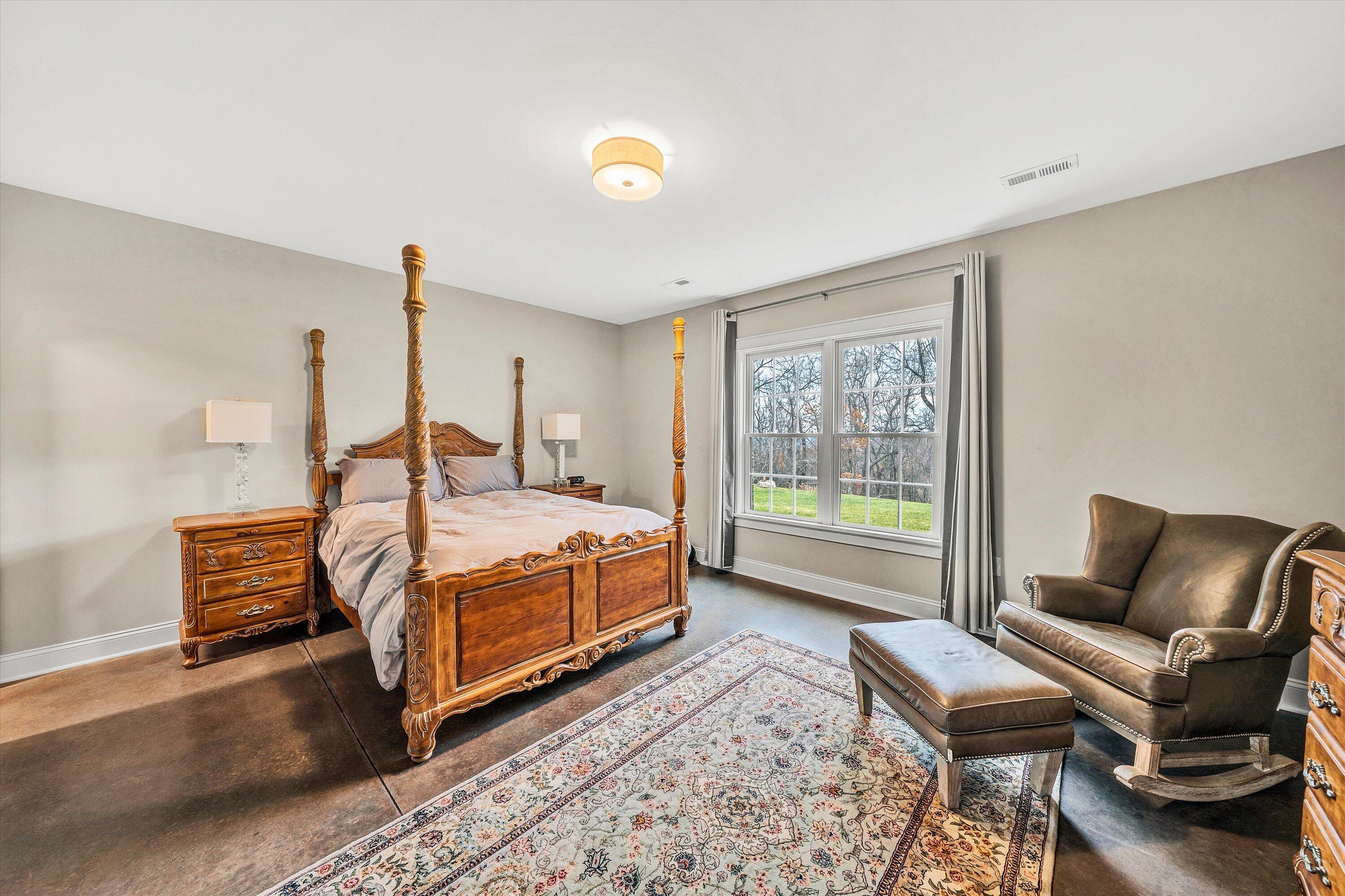6901 Fairway Ridge Road Salem, VA 24153 - Photo 43 of 58 a bedroom with a bed and wooden floor