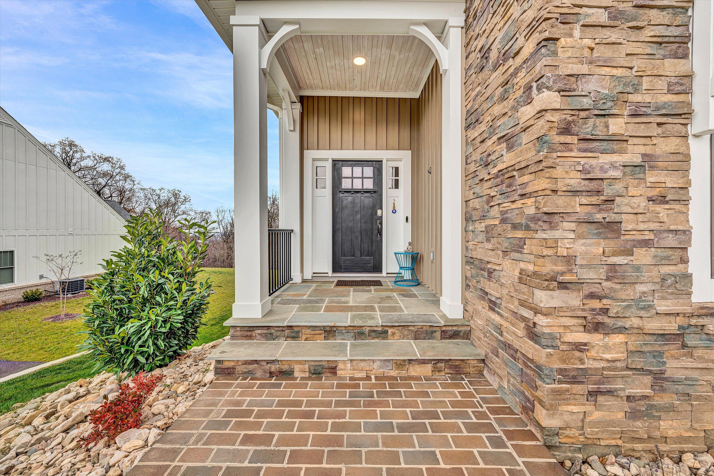 6901 Fairway Ridge Road Salem, VA 24153 - Photo 5 of 58 a view of a brick house with potted plants